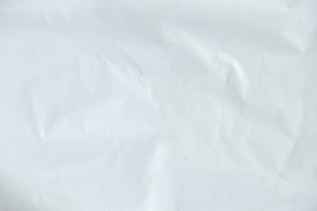 background of white glossy crumpled solid color closeupの写真素材