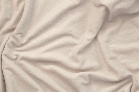 plain white wrinkled fabric close-up as a background, fabric texture