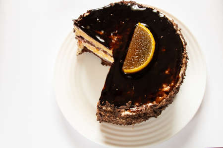 chocolate cake on a plate on a white plate close upの写真素材