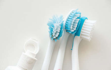 blue toothbrushes on isolated white background close upの写真素材
