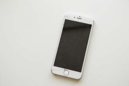 Ukraine Dnipro 10.12.2020 - old iPhone 6 broken on a white background close upのeditorial素材