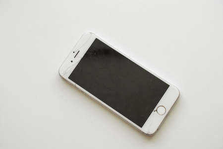 Ukraine Dnipro 10.12.2020 - old iPhone 6 broken on a white background close upのeditorial素材
