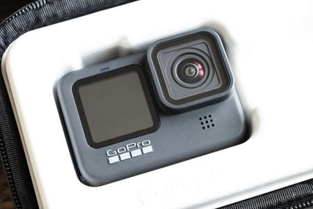 Ukraine Dnepr 01/06/2021 - Camera Go pro 9 lies on a wooden table, a review of the new action cameraのeditorial素材