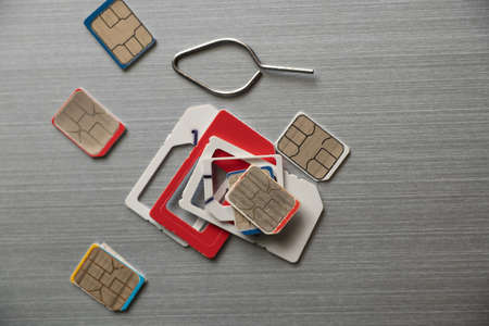 micro sim cards lie on a steel gray background close up