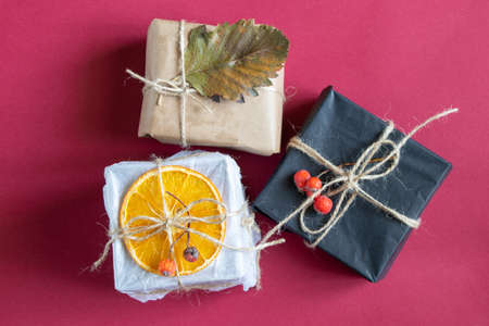 homemade gift boxes on isolated red background close up, giftの写真素材