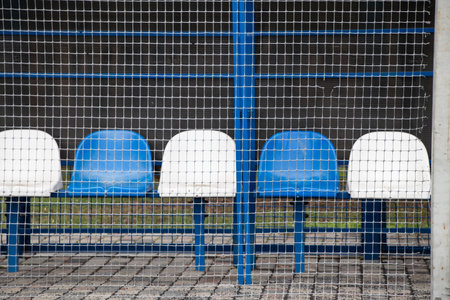 white-blue chairs for rent of a football field at the stadium of Ukraineの写真素材
