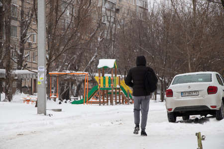 Ukraine Dnipro 01.13.2021 - snow fell in a residential area of the city of Dnipro, city dwellers on the streets of a residential yardのeditorial素材