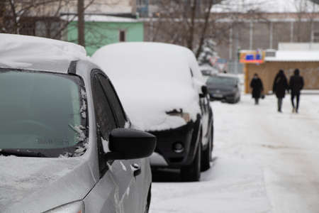 Ukraine Dnipro 01.13.2021 - snow fell in a residential area of the city of Dnipro, city dwellers on the streets of a residential yardのeditorial素材