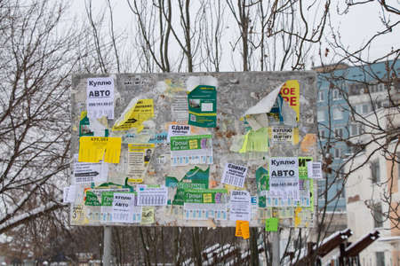 Ukraine Dnipro 13.01.2021 - message board stands on the city street in winterのeditorial素材