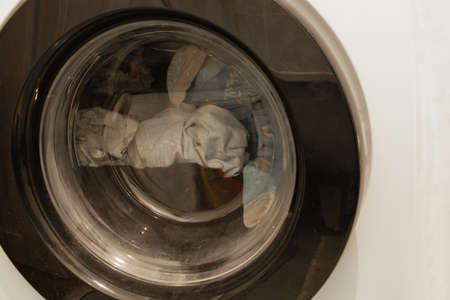 clean things in the washing machine in the bathroom close upの写真素材
