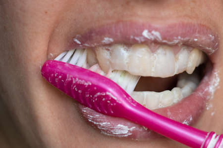 female in toothpaste on an isolated backgroundの写真素材