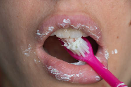 female in toothpaste on an isolated backgroundの写真素材