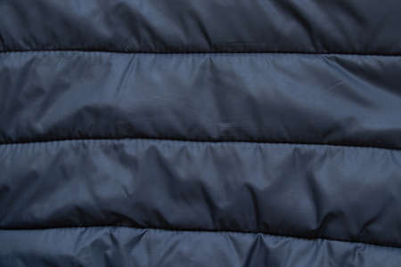 black puffer jacket material as backgroundの写真素材