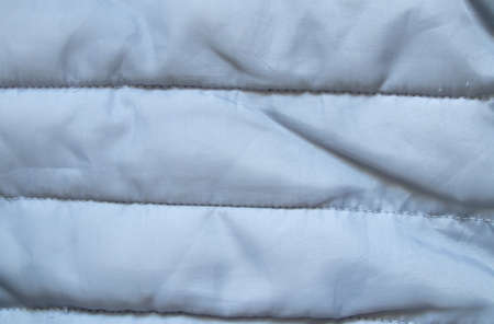 black puffer jacket material as backgroundの写真素材