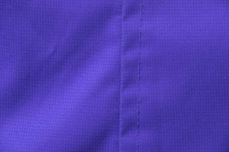 purple jacket fabric as background close upの写真素材