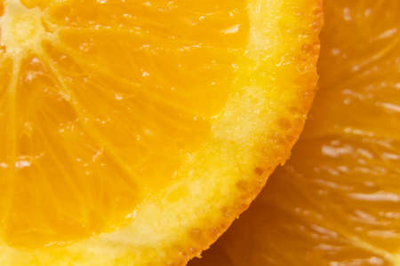 slice of orange in a cut macro photo, fruit backgroundの写真素材