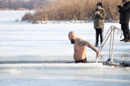 Ukraine Dnipro 19.01.2021 - massive swimming in the river in frost on Epiphanyのeditorial素材