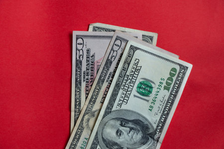 american dollars 100 50 1 lie on isolated background close up, financeの写真素材