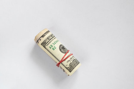 roll with american dollars on isolated background close up, financeの写真素材