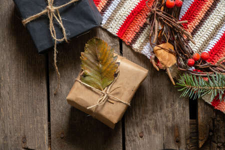 Christmas gift boxes made of paper thread and handmade Christmas decor on a wooden background, gift boxの写真素材