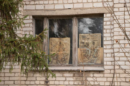 Ukraine Dnipro 11/29/2021 - the newspaper Ukrainian Zorya pasted on the glass on the window of a...