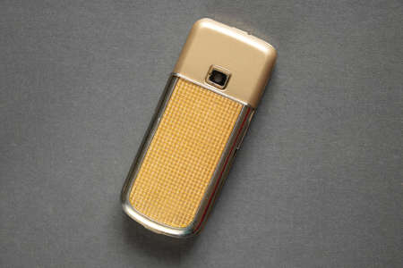 Ukraine Dnipro 10/23/2020 - Nokia 8800 gold lies on an isolated background, an old rarity phoneのeditorial素材