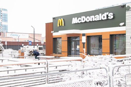Ukraine Dnipro 08.03.2021 - a new building of McDonald's in a residential area of the city of Dnipro in winterのeditorial素材