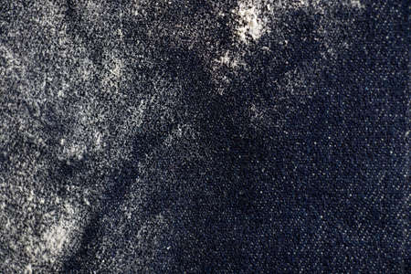 dark cloth in flour as background close upの写真素材