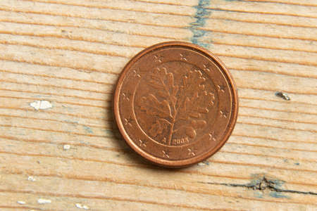 coin one cent macro photo on wooden backgroundの写真素材