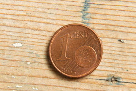 coin one cent macro photo on wooden backgroundの写真素材