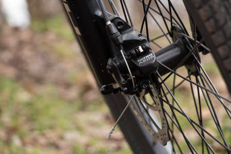 Ukraine Dnepr 06.04.2021 - a new red electric bike in the park in the spring in the sun, a bike rideのeditorial素材