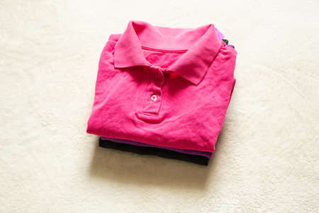 polo multicolored rumpled lie on the table close up, women's polo