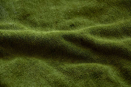 green terry soft towel as background close-upの写真素材