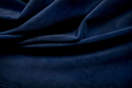 dark blue fabric wrinkled as background close-up