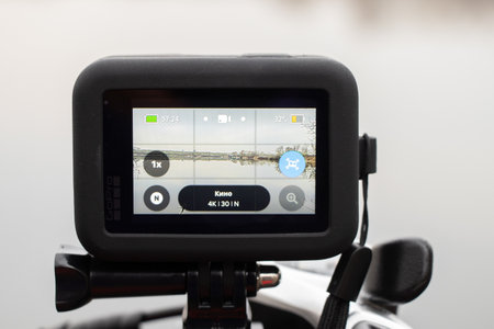 Ukraine Dnipro 20.04.201 - GoPro HERO 9 Black on a bicycle in the forest in spring, shooting on an action camera from a bicycle handle, camera screenのeditorial素材