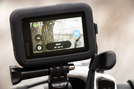Ukraine Dnipro 20.04.201 - GoPro HERO 9 Black on a bicycle in the forest in spring, shooting on an action camera from a bicycle handle, camera screenのeditorial素材