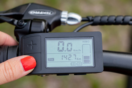 Ukraine Dnipro 08.05.2021 - display with buttons and speed switches and a battery charge sensor on the handlebars of an electric bike, an electric bikeのeditorial素材
