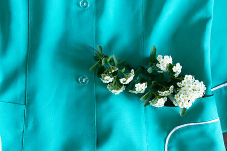 an old nurse's suit lies on a wooden table, the uniform of a medical worker in Ukraine, a doctor's...