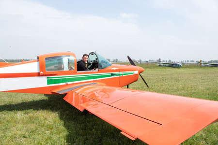 a man driving a four-seater plane at an airfield in Ukraine in the city of Dnipro, driving an...