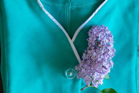an old nurse's suit lies on a wooden table, the uniform of a medical worker in Ukraine, a doctor's...