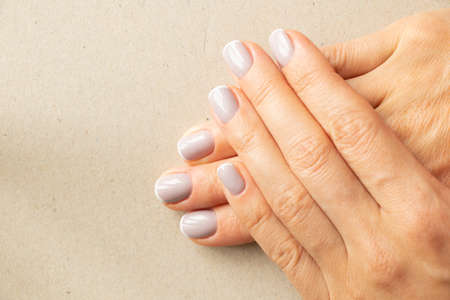 female hands with french manicure on isolated background, female manicureの写真素材