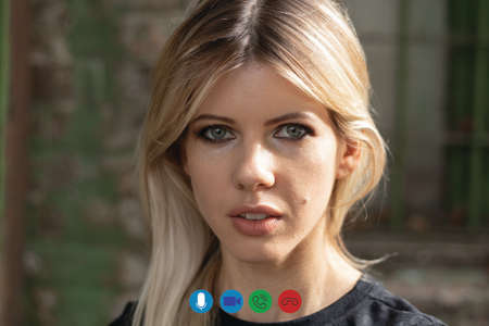 girl talking on a video call in the computer for the background, video chat with a girlの写真素材