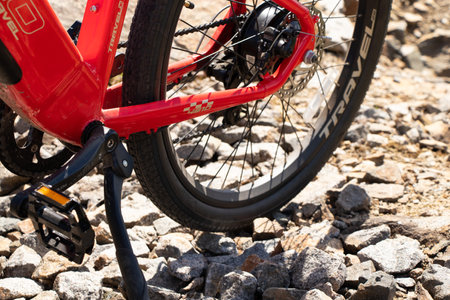 Ukraine Dnepr 08.05 .2021 - a new red electric bike stands on a stone granite quarry, new technologiesのeditorial素材