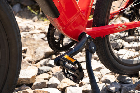 Ukraine Dnepr 08.05 .2021 - a new red electric bike stands on a stone granite quarry, new technologiesのeditorial素材