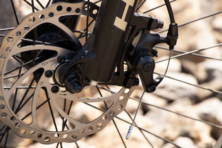 Ukraine Dnepr 08.05 .2021 - a new red electric bike stands on a stone granite quarry, new...