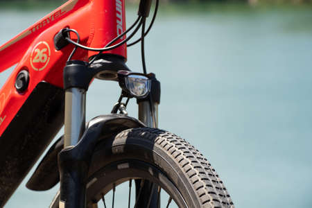 Ukraine Dnepr 08.05 .2021 - a new red electric bike stands on a stone granite quarry, new technologiesのeditorial素材