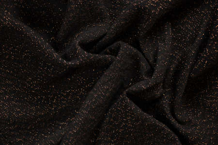 black crumpled fabric with shiny splashesの写真素材