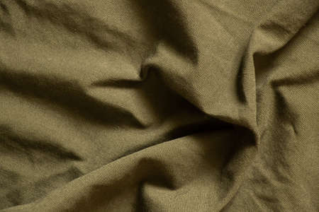 dark green crumpled fabric as background, fabricの写真素材
