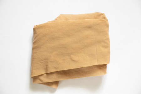 womens nylon beige tights close up on an isolated backgroundの写真素材