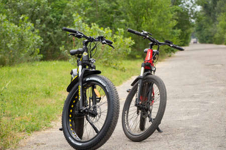 Ukraine Dnipro 27.06.2021 - electric bike in the park during the day for a walk, city electric transport, environmentally friendly transportのeditorial素材